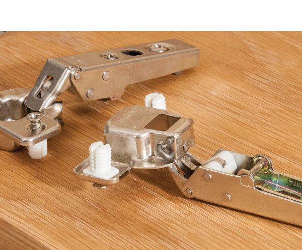 Installed view of European 3D soft-close concealed cabinet hinge with dowels